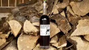 Blackfish Sweet Tea on a Wood Pile